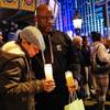 Parents Heidi and Kenneth Cherry Sr. stand in silence while attending a vigil held in memory of their son, Kenneth Cherry Jr., at the corner of Flamingo Road and Las Vegas Boulevard Friday night, February 22, in Las Vegas.